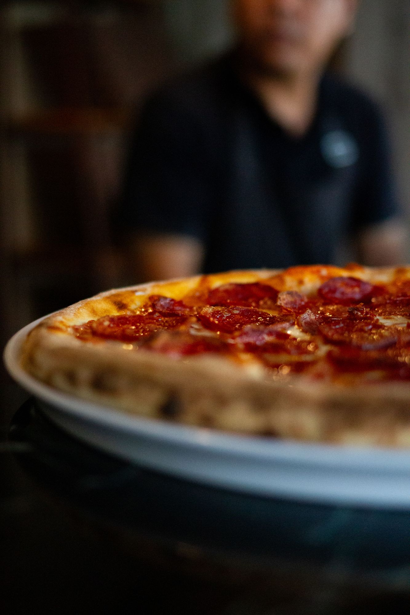 Close-up of a salami pizza fresh from the oven